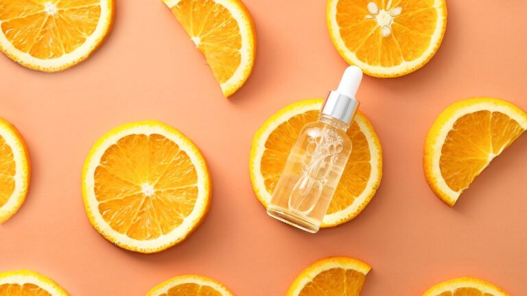 Essential vitamins for skin health, Vitamin C serum displayed, vitamins are essential for clear skin